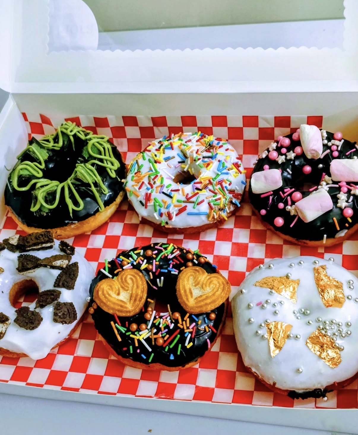 Box of six decorated donuts